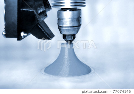 Modern 3D printer printing figure blue colors close-up Modern 3D printer printing figure blue colors close-up 77074146