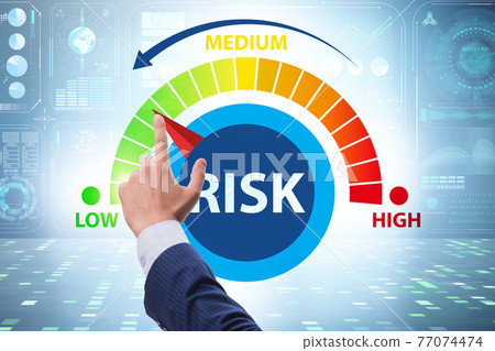 Businessman in risk metering and management concept Businessman in risk metering and management concept 77074474