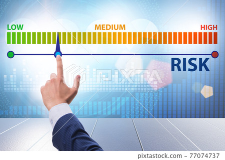 Businessman in risk metering and management concept Businessman in risk metering and management concept 77074737