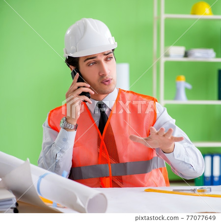 Man architect working on the project Man architect working on the project 77077649
