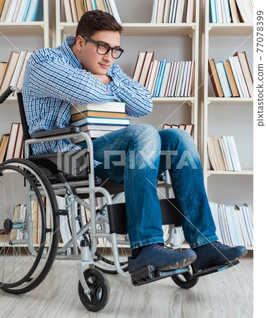 Disabled student studying in the library 77078399