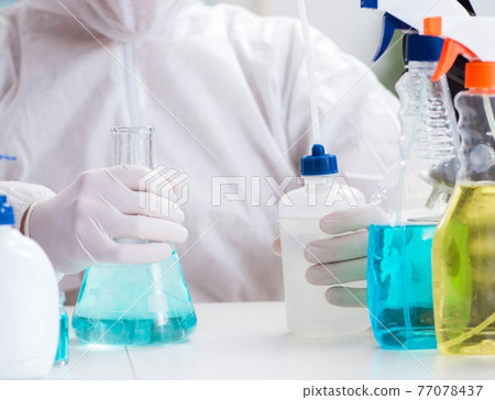 Chemist checking the quality of bathroom supplies 77078437