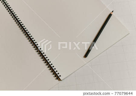 Sketchbook and pencil 77079644
