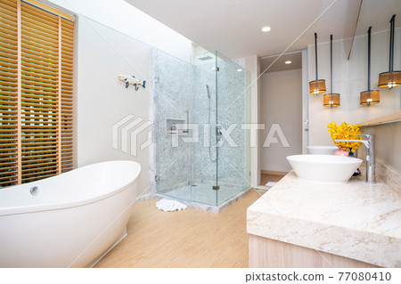 white bathtub in luxury bathroom white bathtub in luxury bathroom 77080410