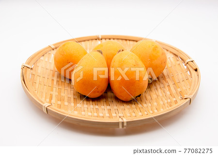 Loquats on a colander, big loquats for gifts 77082275