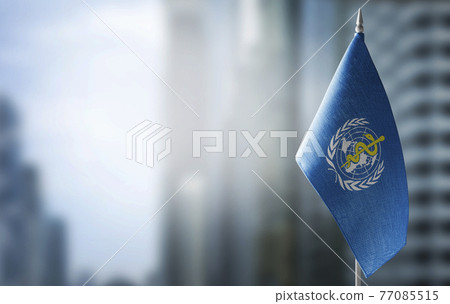 Patch of the national flag of the World Health Organization WHO on a white t-shirt 77085515