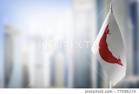 A small flag of Easter Island on the background of a blurred background A small flag of Easter Island on the background of a blurred background 77086214