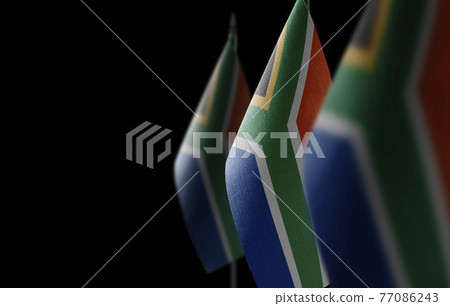 Small national flags of the South Africa on a black background 77086243