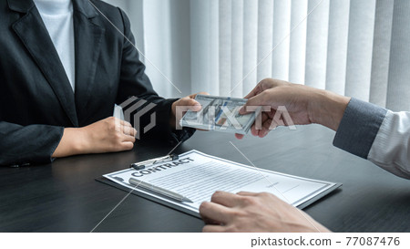 Dishonest cheating in business illegal money, Business woman giving bribe money in business people to give success the deal contract of investment, Bribery and corruption concept Dishonest cheating in business illegal money, Business woman giving bribe money in business people to give success the deal contract of investment, Bribery and corruption concept 77087476