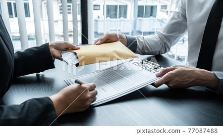 Dishonest cheating in business illegal money, Business woman giving bribe money in business people to give success the deal contract of investment, Bribery and corruption concept Dishonest cheating in business illegal money, Business woman giving bribe money in business people to give success the deal contract of investment, Bribery and corruption concept 77087488