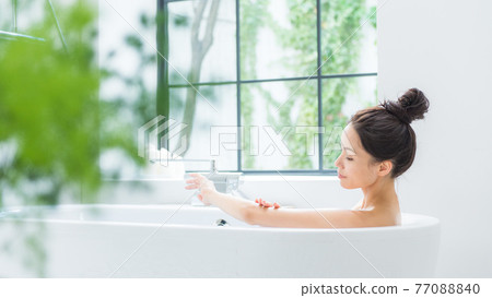 Women taking a bath banner 77088840