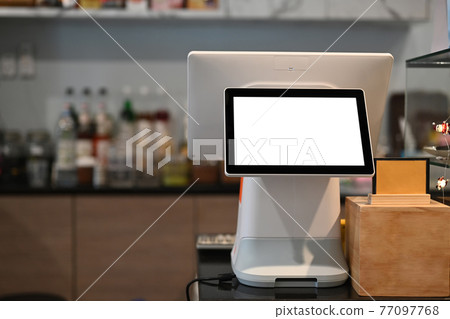 A touchscreen cashier machine with blank screen at modern coffee shop. 77097768
