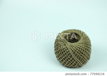 Isolated image of Hemp rope ball sting on white background. Isolated image of Hemp rope ball sting on white background. 77099216