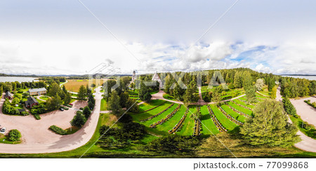 Hollola, Finland - 9 September 2019: Panoramic aerial view of old medieval stone church of St. Mary in Hollola, Finland 77099868