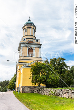 Hollola, Finland - 9 September 2019: Bell tower of old medieval stone church of St. Mary in Hollola, Finland Hollola, Finland - 9 September 2019: Bell tower of old medieval stone church of St. Mary in Hollola, Finland 77099875
