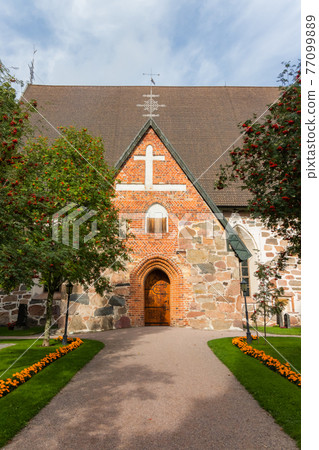 Hollola, Finland - 9 September 2019: Old medieval stone church of St. Mary in Hollola, Finland 77099889