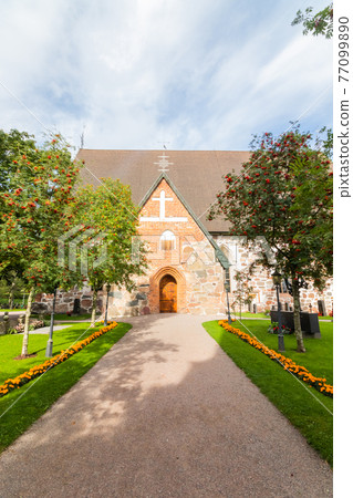 Hollola, Finland - 9 September 2019: Old medieval stone church of St. Mary in Hollola, Finland Hollola, Finland - 9 September 2019: Old medieval stone church of St. Mary in Hollola, Finland 77099890