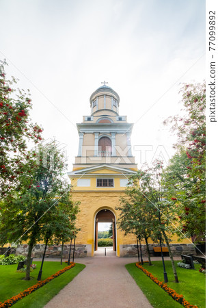 Hollola, Finland - 9 September 2019: Bell tower of old medieval stone church of St. Mary in Hollola, Finland Hollola, Finland - 9 September 2019: Bell tower of old medieval stone church of St. Mary in Hollola, Finland 77099892