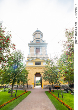 Hollola, Finland - 9 September 2019: Bell tower of old medieval stone church of St. Mary in Hollola, Finland 77099893