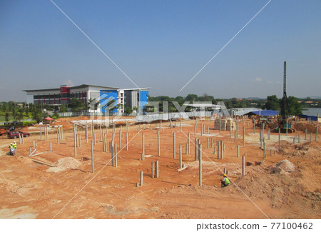 SEREMBAN, MALAYSIA -JANUARY 08, 2017: Construction site with piling work is in progress. Piling work is the most popular for the building foundation work. SEREMBAN, MALAYSIA -JANUARY 08, 2017: Construction site with piling work is in progress. Piling work is the most popular for the building foundation work. 77100462
