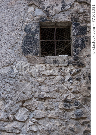 External view of an ancient vintage window of a medieval town in Italy, Europe. External view of an ancient vintage window of a medieval town in Italy, Europe. 77101381