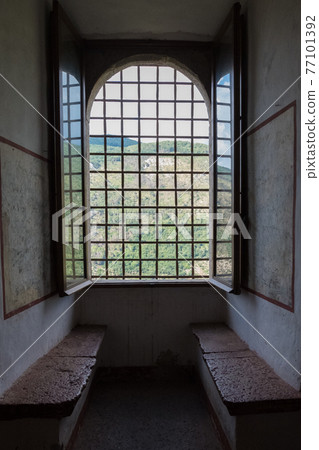 External view of an ancient vintage window of a medieval town in Italy, Europe. External view of an ancient vintage window of a medieval town in Italy, Europe. 77101392