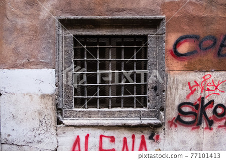 External view of an ancient vintage window of a medieval town in Italy, Europe. External view of an ancient vintage window of a medieval town in Italy, Europe. 77101413