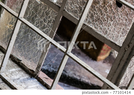 External view of an ancient vintage window of a medieval town in Italy, Europe. 77101414