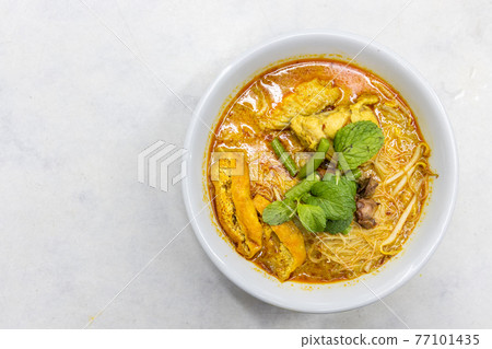 Overhead view of simple and delicious curry mee or noodle, popular cuisine in Malaysia Overhead view of simple and delicious curry mee or noodle, popular cuisine in Malaysia 77101435