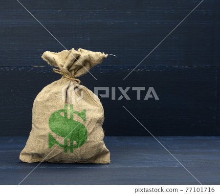 brown full canvas bag with dollar symbol on blue background. Savings, loan and investment concept 77101716