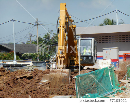 MALACCA, MALAYSIA -FEBRUARY 16, 2017: Excavators machine is a heavy construction machine used excavated soil during construction. Powered by a long hydraulic arm with the bucket.   77105921