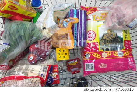 KUALA LUMPUR, MALAYSIA -AUGUST 28, 2016: Selected to buy grocery in the shopping trolley. KUALA LUMPUR, MALAYSIA -AUGUST 28, 2016: Selected to buy grocery in the shopping trolley. 77106316