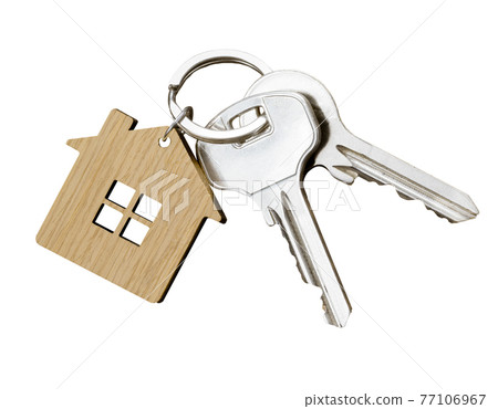 House keys with house shaped keychain isolated on white background 77106967