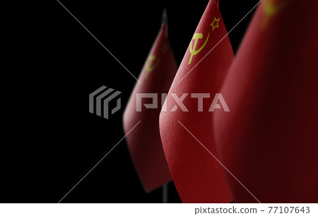 Small national flags of the USSR on a dark background Small national flags of the USSR on a dark background 77107643