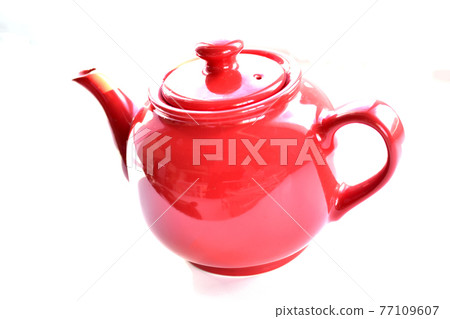 Red ceramic teapot on white background Red ceramic teapot on white background 77109607