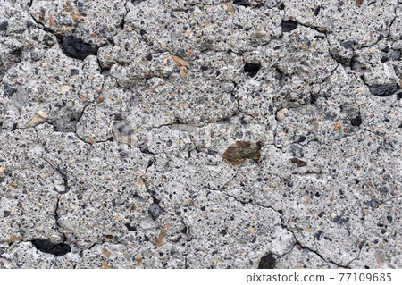 The surface of an old cinder block falling apart The surface of an old cinder block falling apart 77109685