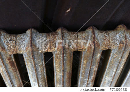 A rusty old Soviet radiator battery pack A rusty old Soviet radiator battery pack 77109688