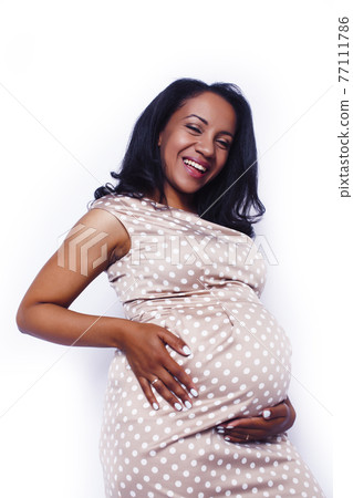 young pretty pregnant african american woman emotional posing isolated on white background, lifestyle people concept young pretty pregnant african american woman emotional posing isolated on white background, lifestyle people concept 77111786