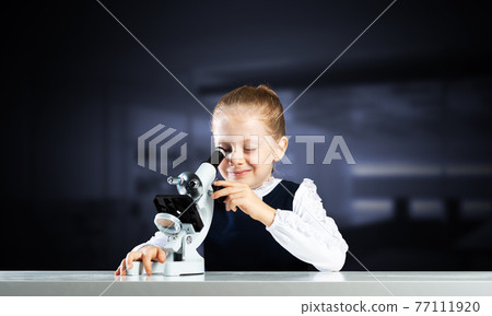 Little scientist looking through microscope Little scientist looking through microscope 77111920