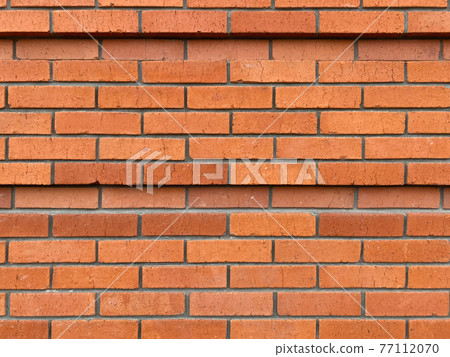 Red brick wall in rows, tiers. With small cracks. Masonry, ledge, 2 lines of recess, deepening Red brick wall in rows, tiers. With small cracks. Masonry, ledge, 2 lines of recess, deepening 77112070