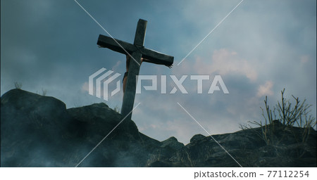 Jesus Christ hanging on cross against cloudy sky Jesus Christ hanging on cross against cloudy sky 77112254