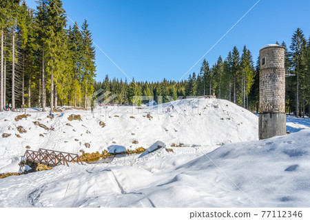 Broken dam in winter mountains Broken dam in winter mountains 77112346
