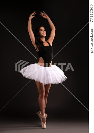 Pretty ballerina in tutu stand on pointess Pretty ballerina in tutu stand on pointess 77112569