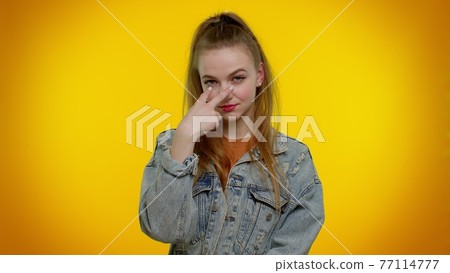 Teen stylish girl pointing at her eyes and camera, show I am watching you gesture, spying on someone Teen stylish girl pointing at her eyes and camera, show I am watching you gesture, spying on someone 77114777