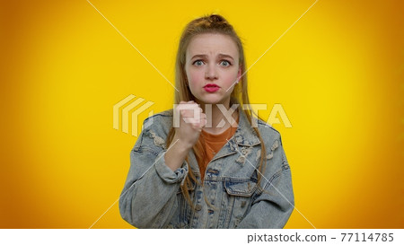 Girl screams from stress tension problems feels horror hopelessness fear surprise shock rage emotion Girl screams from stress tension problems feels horror hopelessness fear surprise shock rage emotion 77114785