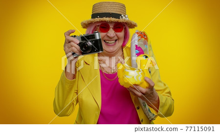 Elderly woman grandmother tourist photographer taking photos on camera, travel, holiday vacations Elderly woman grandmother tourist photographer taking photos on camera, travel, holiday vacations 77115091