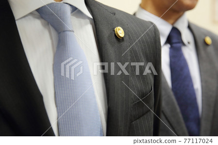 Two men in suits with lawyer badges Upper body 77117024