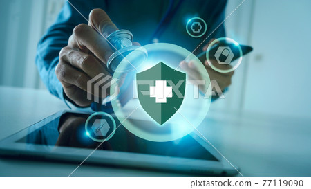 Medical doctor holding stethoscope and mobile, immune system shield for protect your body from danger virus concept. Medical doctor holding stethoscope and mobile, immune system shield for protect your body from danger virus concept. 77119090