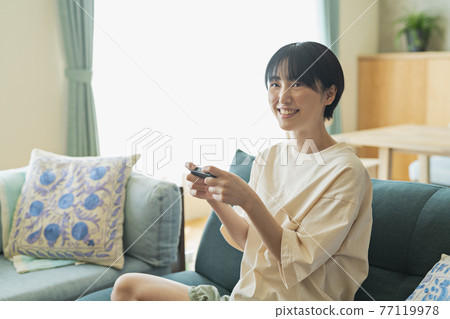 Woman playing games Woman playing games 77119978