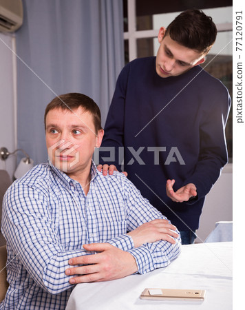 Adult son is wanting talking with his father after conflict Adult son is wanting talking with his father after conflict 77120791